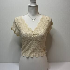 Size Medium Romantic and feminine short sleeve lace top with scalloped edge
